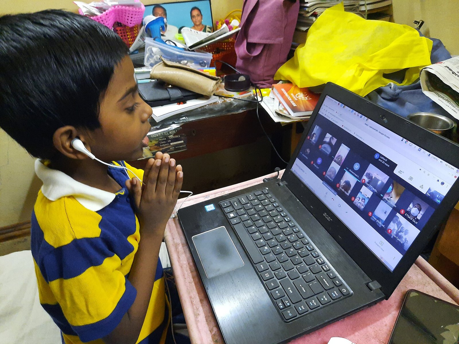 Student attending an online tuition class on a laptop